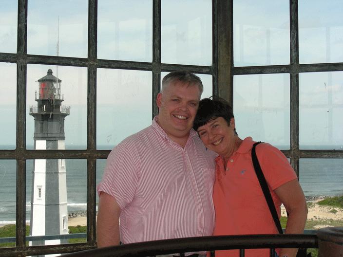 MomDaveTopLighthouse.gif - Dave & Carlann posing after the ascent