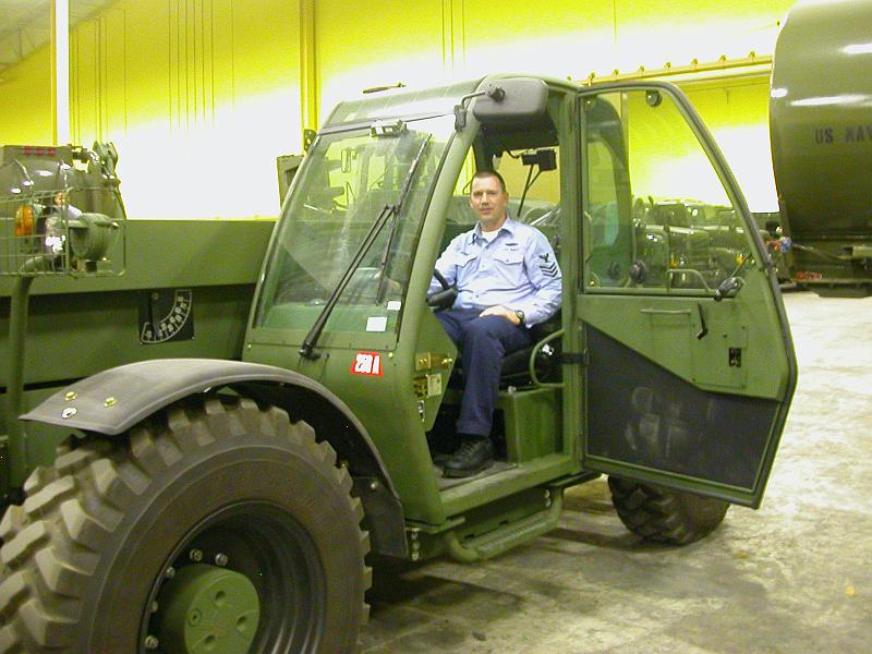 DSCN7818.jpg - Chris' new riding lawnmower.  Oh, wait...that belongs to the Navy!